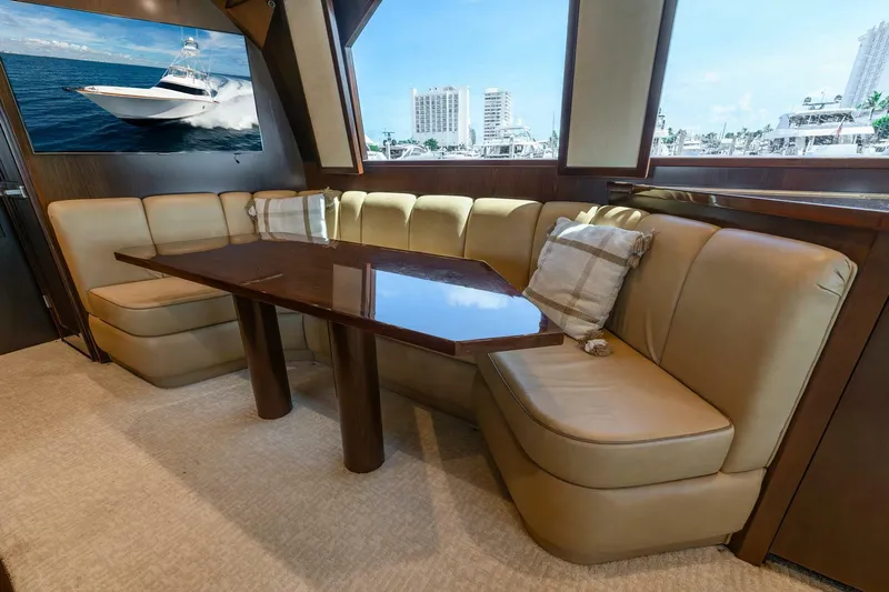 The Provider Yacht Photos Pics Luxurious interior of 2015 Viking 76 Convertible yacht with plush seating and elegant table.