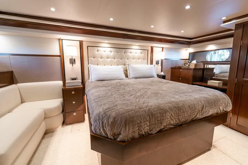 The Provider Yacht Photos Pics Luxurious bedroom interior of 2015 Viking 76 Convertible yacht with elegant furnishings.