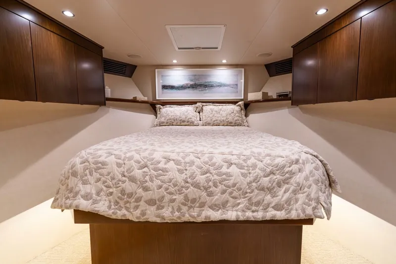 The Provider Yacht Photos Pics Luxurious bedroom interior of 2015 Viking 76 Convertible yacht with elegant bedding.