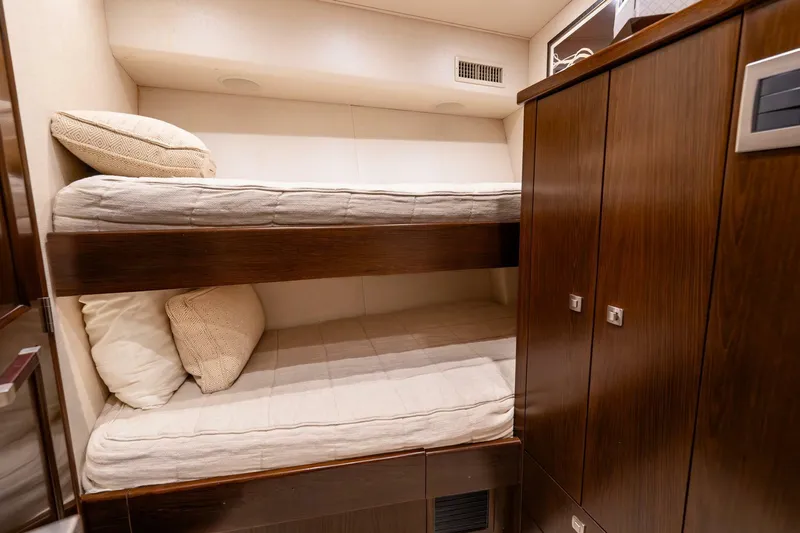 The Provider Yacht Photos Pics Bunk beds in 2015 Viking 76 Convertible yacht cabin with wooden cabinetry.