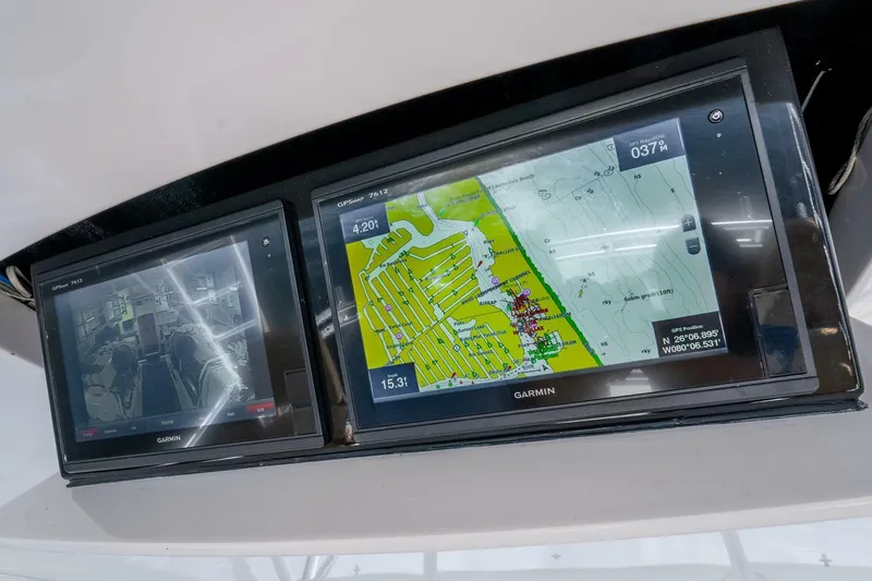 The Provider Yacht Photos Pics Dual Garmin displays on 2015 Viking 76 Convertible, showing navigation and radar data.