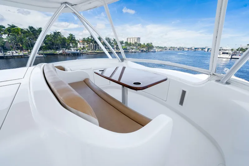 The Provider Yacht Photos Pics Luxurious seating area on 2015 Viking 76 Convertible yacht, overlooking serene waterfront views.