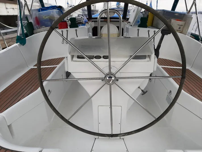 Sao Miguel Yacht Photos Pics Cockpit of a 2000 Beneteau Oceanis 40 sailboat with large steering wheel.