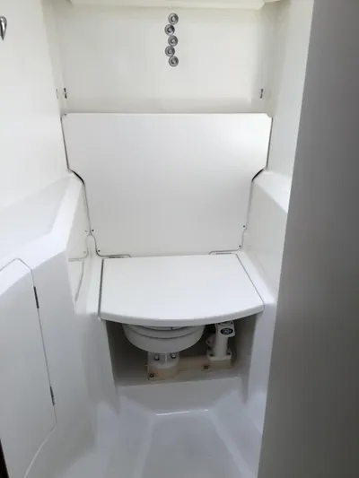 Sao Miguel Yacht Photos Pics Beneteau Oceanis 40 (2000) yacht bathroom with compact marine toilet.