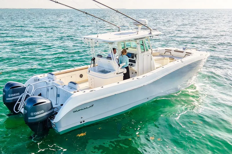 Complete Lunasea Yacht Photos Pics 2018 World Cat 320 CC boat on clear ocean water with dual Yamaha engines.