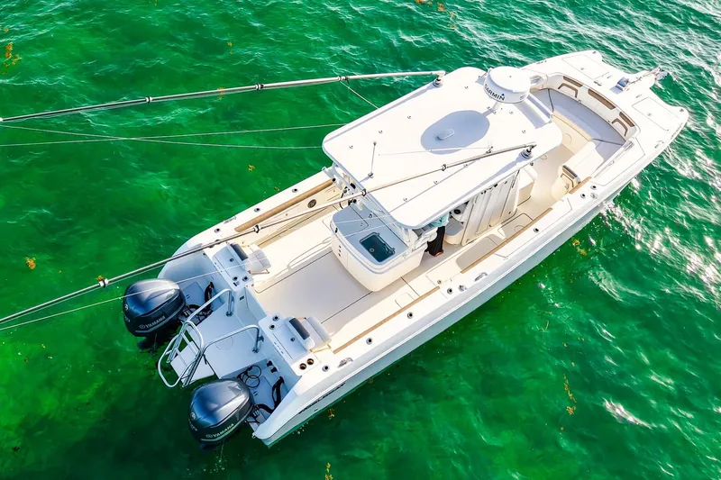 Complete Lunasea Yacht Photos Pics 2018 World Cat 320 CC boat on clear green water, aerial view.