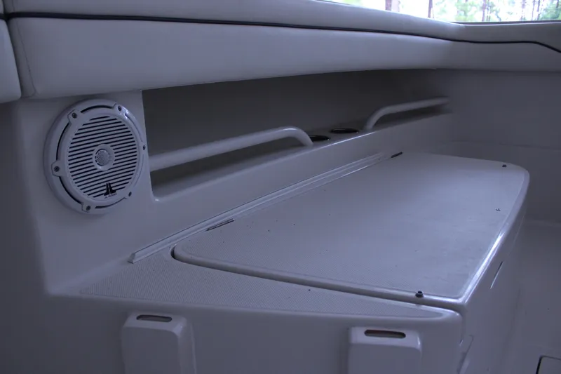  Yacht Photos Pics Interior of 2017 Jupiter 30 HFS boat featuring speaker and storage compartment.