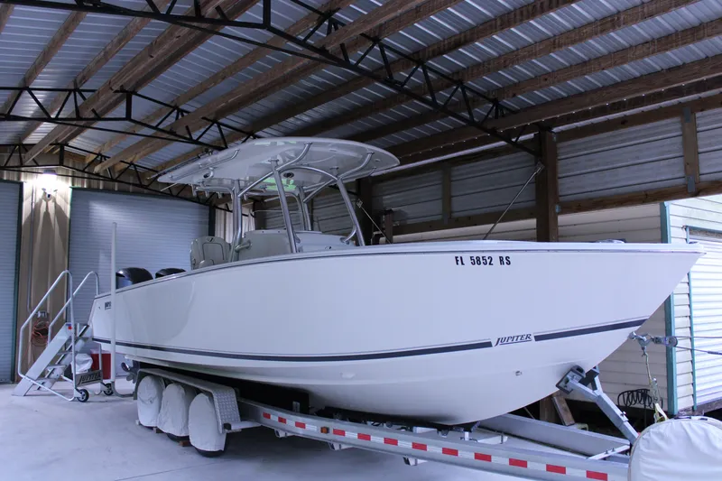  Yacht Photos Pics 2017 Jupiter 30 HFS boat on trailer in covered storage.