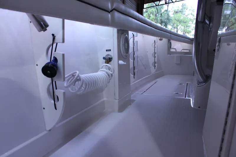  Yacht Photos Pics 2017 Jupiter 30 HFS boat interior with coiled hose and storage compartments.