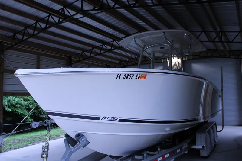  Yacht Photos Pics 2017 Jupiter 30 HFS boat on trailer in covered storage area.