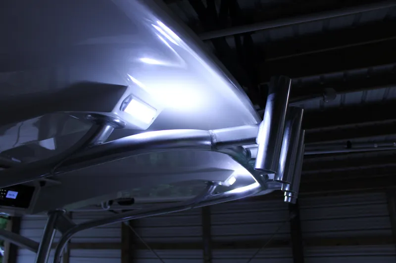  Yacht Photos Pics 2017 Jupiter 30 HFS boat with illuminated T-top and rod holders in a dimly lit setting.