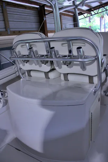  Yacht Photos Pics 2017 Jupiter 30 HFS boat interior with rod holders and seating in a covered storage area.