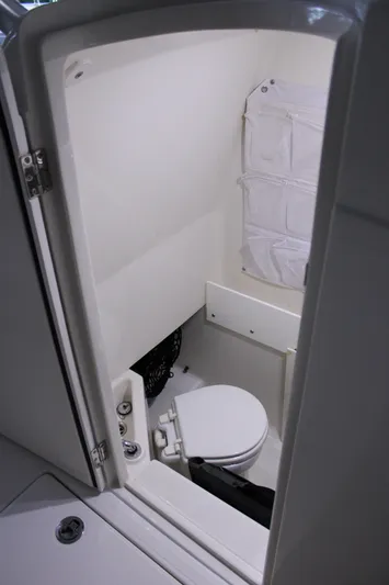  Yacht Photos Pics 2017 Jupiter 30 HFS boat interior with compact marine toilet.