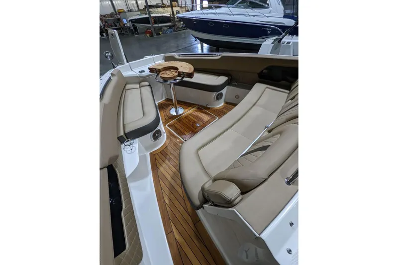  Yacht Photos Pics 2017 Sea Ray SLX 400 boat interior with luxurious seating and wooden flooring.