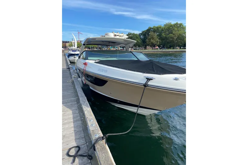  Yacht Photos Pics 2017 Sea Ray SLX 400 boat docked by the waterfront on a sunny day.