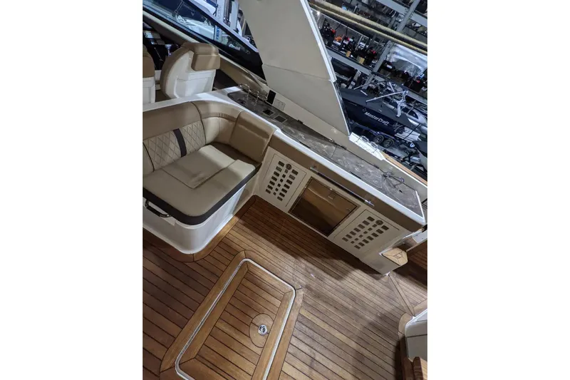  Yacht Photos Pics Luxurious interior of 2017 Sea Ray SLX 400 boat with elegant seating and wood flooring.