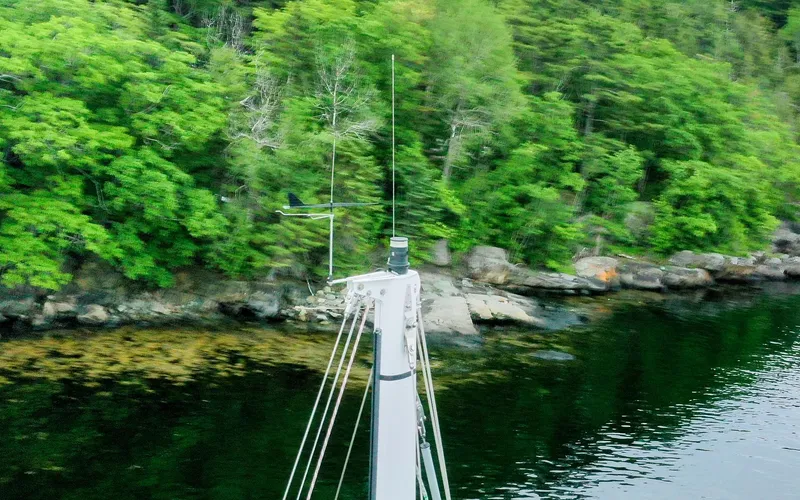 If Yacht Photos Pics Mast of 2018 Marples CC 40 Fast Cruiser near lush green shoreline.