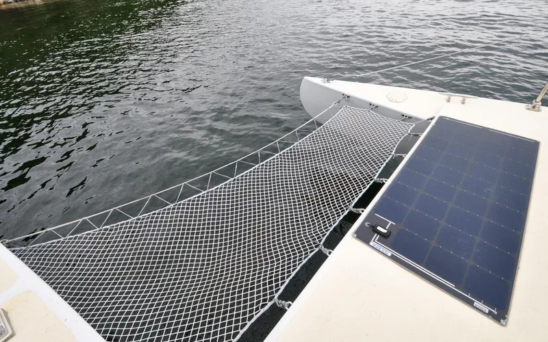 If Yacht Photos Pics Custom Marples CC 40 Fast Cruiser 2018 with solar panel and netting over water.