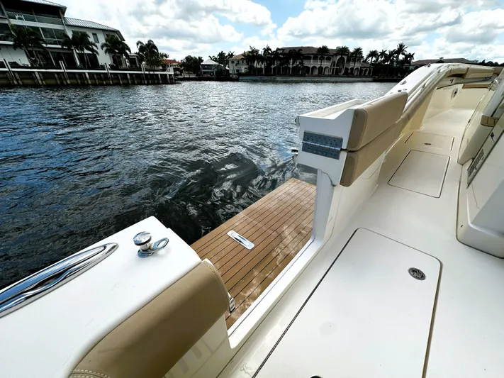  Yacht Photos Pics 2020 Scout 380 LXF boat deck with waterfront view and luxurious seating.