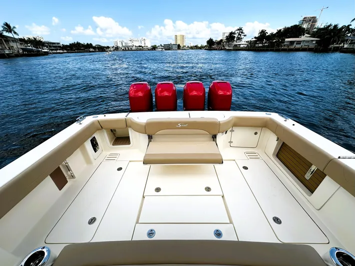  Yacht Photos Pics 2020 Scout 380 LXF boat with quad engines on a calm waterway.