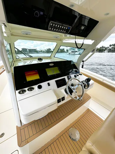  Yacht Photos Pics 2020 Scout 380 LXF boat helm with advanced navigation system and luxurious interior.