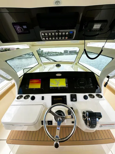  Yacht Photos Pics 2020 Scout 380 LXF boat helm with advanced navigation displays and controls.