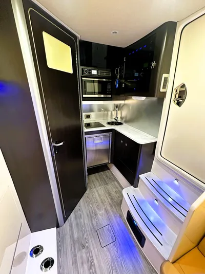  Yacht Photos Pics 2020 Scout 380 LXF interior with modern kitchen, sleek cabinetry, and ambient lighting.