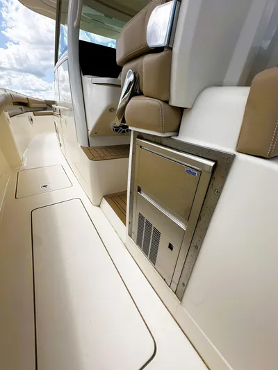  Yacht Photos Pics 2020 Scout 380 LXF boat interior with seating and built-in storage.