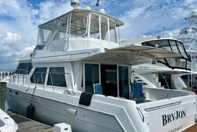  Yacht Photos Pics 2002 Navigator Classic 53 yacht docked at marina under blue sky.