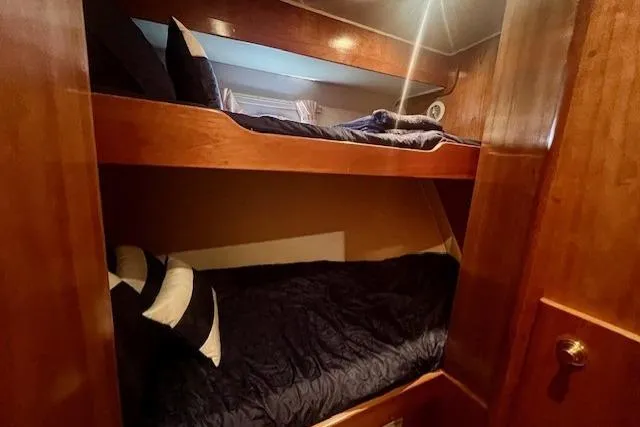  Yacht Photos Pics Bunk beds in 2002 Navigator Classic 53 yacht cabin with wooden interior.