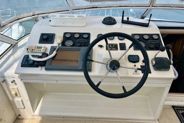 Yacht Photos Pics Cockpit of 2002 Navigator Classic 53 yacht with steering wheel and navigation instruments.