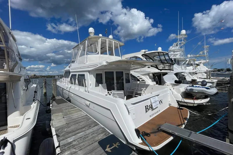  Yacht Photos Pics 2002 Navigator Classic 53 yacht docked at marina under blue sky.