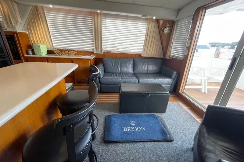  Yacht Photos Pics Interior of 2002 Navigator Classic 53 yacht with leather seating and bar area.