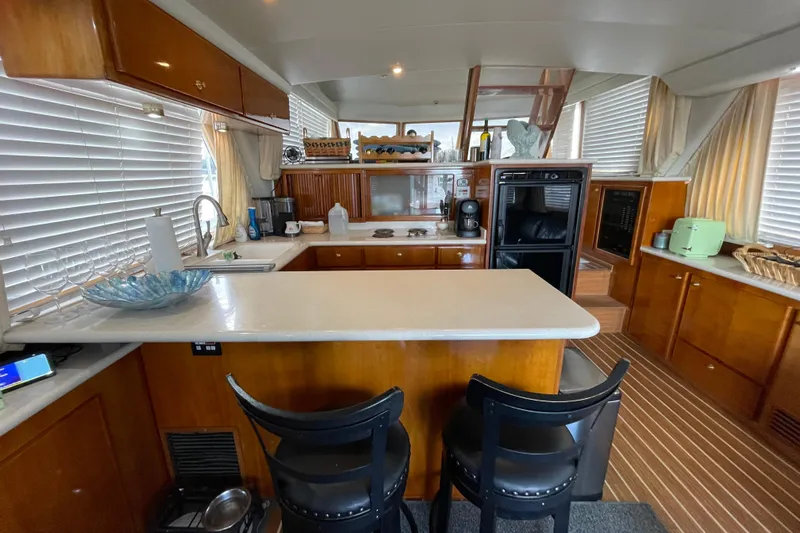  Yacht Photos Pics Luxurious kitchen interior of 2002 Navigator Classic 53 yacht with modern amenities.
