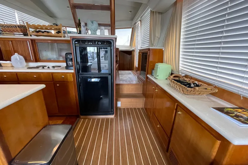  Yacht Photos Pics Interior of 2002 Navigator Classic 53 yacht with wooden cabinetry and modern kitchen amenities.