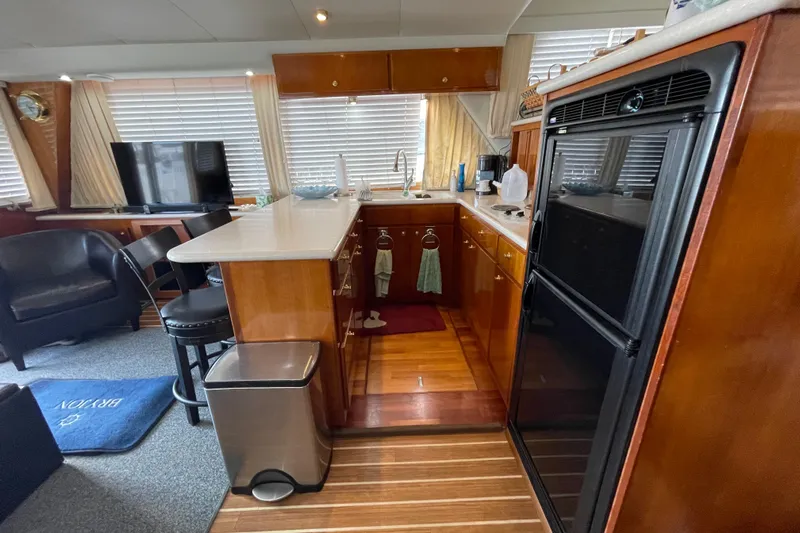  Yacht Photos Pics Luxurious kitchen interior of 2002 Navigator Classic 53 yacht with modern amenities.