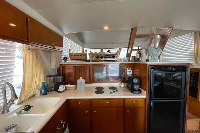  Yacht Photos Pics Luxurious kitchen interior of 2002 Navigator Classic 53 yacht with modern appliances.