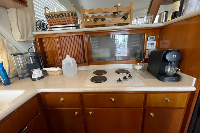  Yacht Photos Pics Kitchen area in a 2002 Navigator Classic 53 yacht with stove and coffee maker.