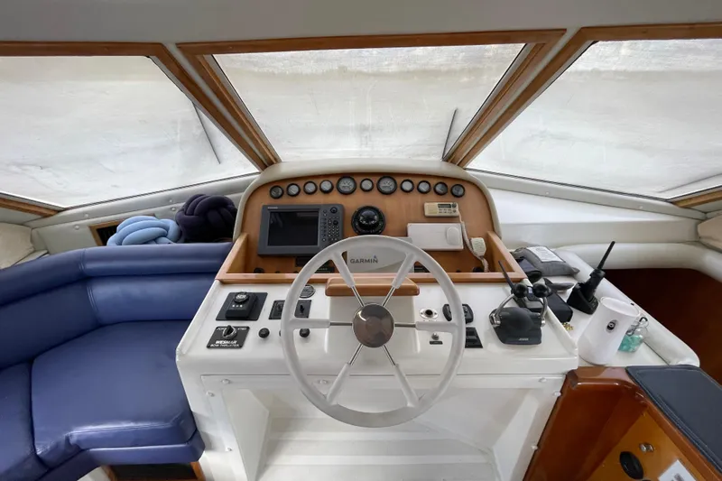  Yacht Photos Pics Cockpit of 2002 Navigator Classic 53 yacht with steering wheel and navigation instruments.
