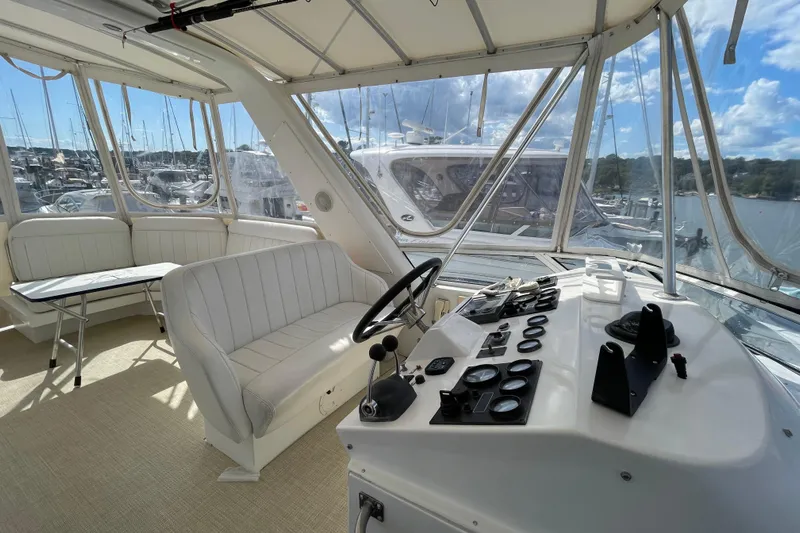  Yacht Photos Pics Interior of 2002 Navigator Classic 53 yacht with helm and seating area.