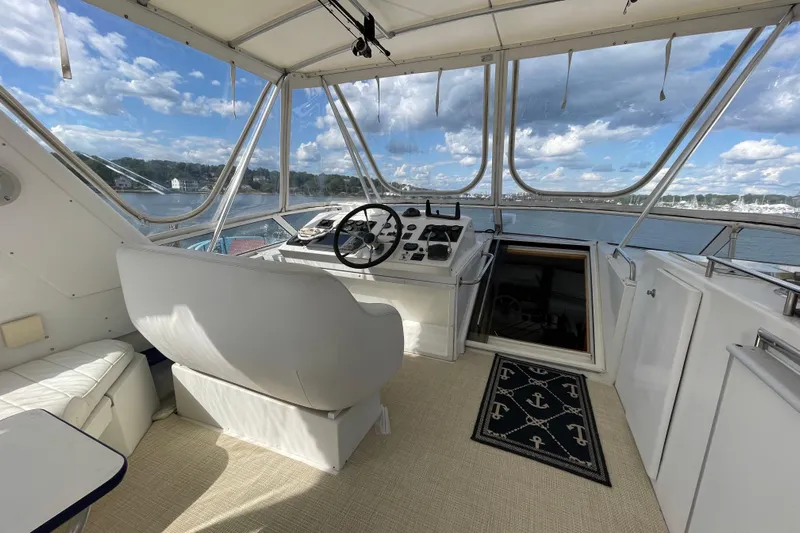  Yacht Photos Pics Helm of 2002 Navigator Classic 53 yacht with panoramic water views.