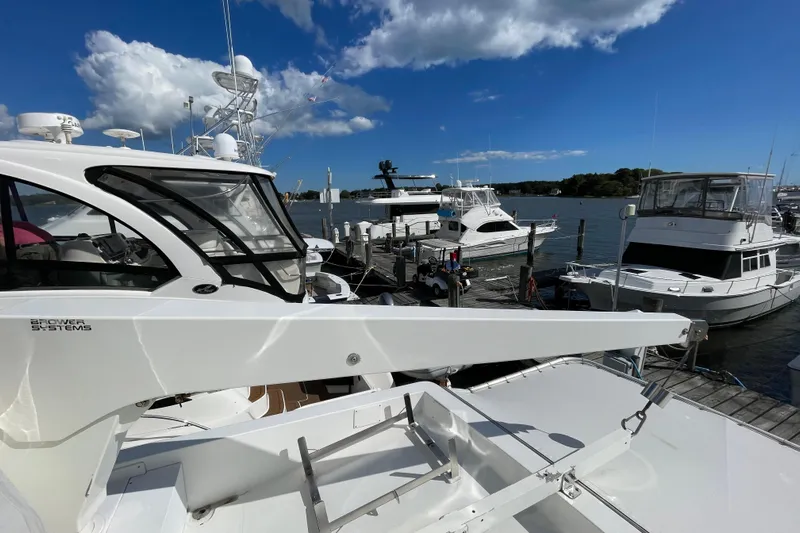  Yacht Photos Pics Docked yachts under a clear blue sky, featuring a 2002 Navigator Classic 53.