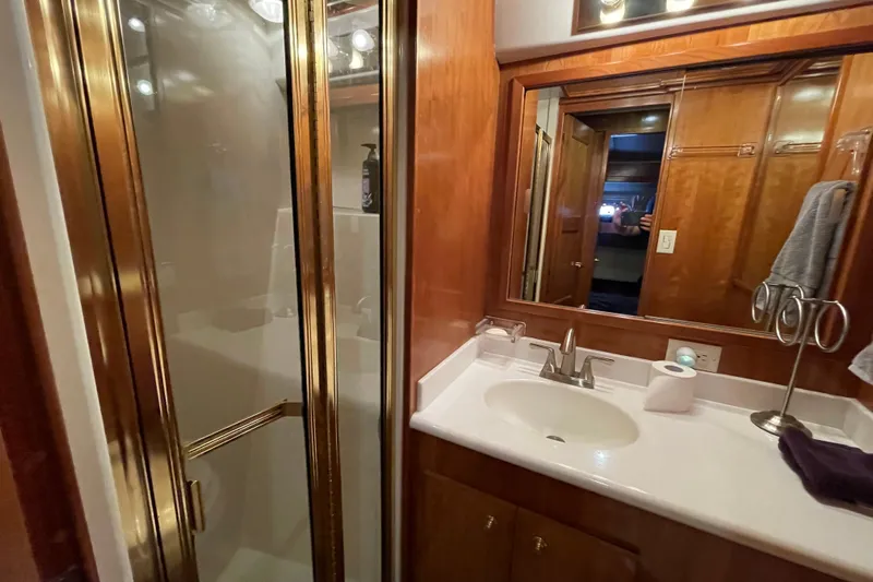  Yacht Photos Pics Bathroom interior of 2002 Navigator Classic 53 yacht with shower and sink.