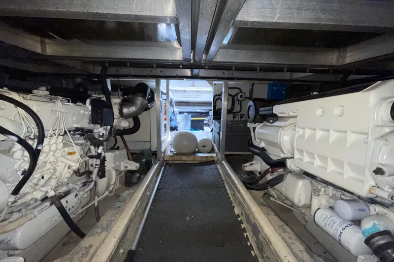  Yacht Photos Pics Engine room of 2002 Navigator Classic 53 yacht, showcasing dual engines and mechanical components.