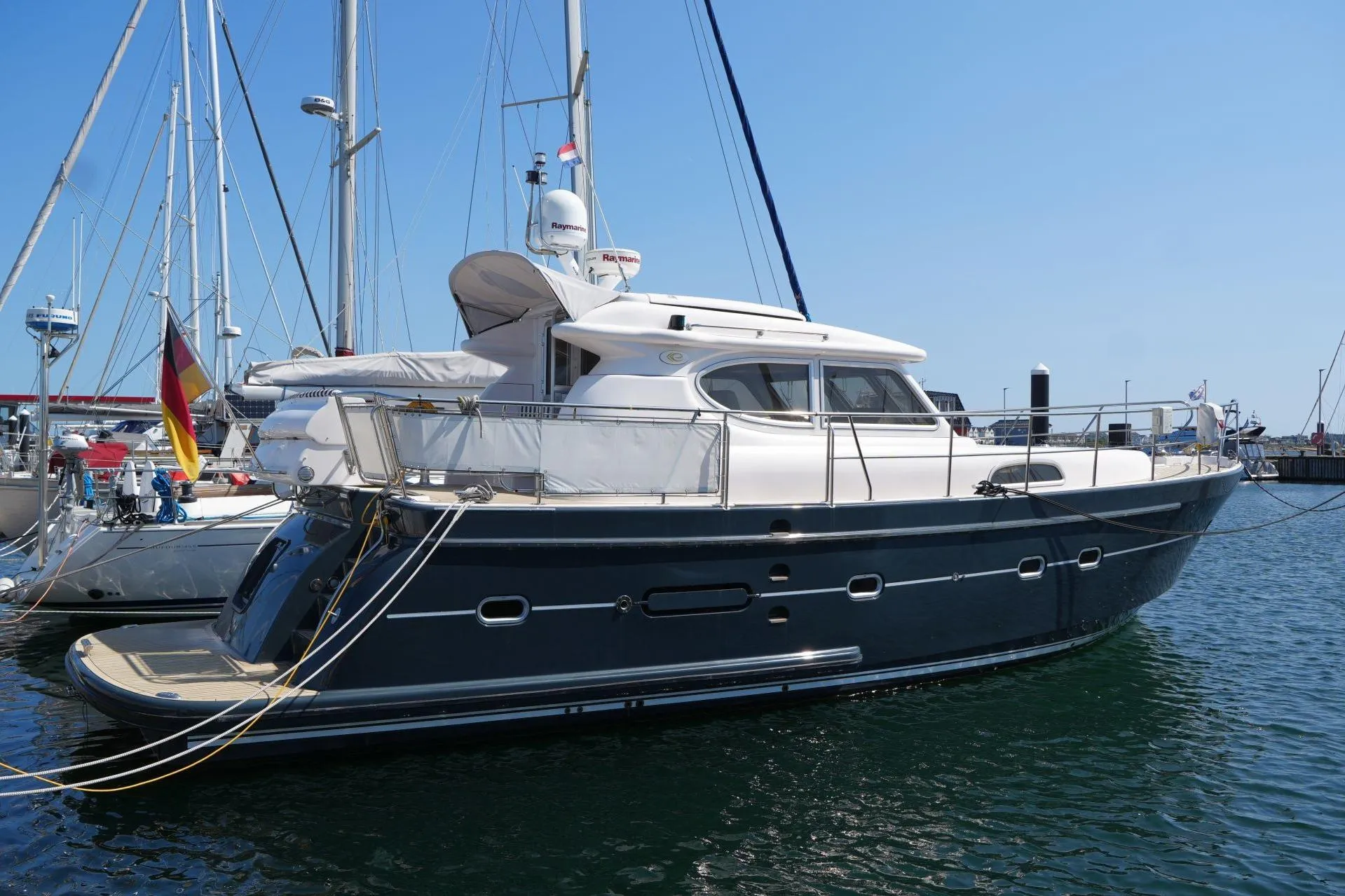 2016 Elling E3 Ultimate yacht docked in a marina under clear blue skies.