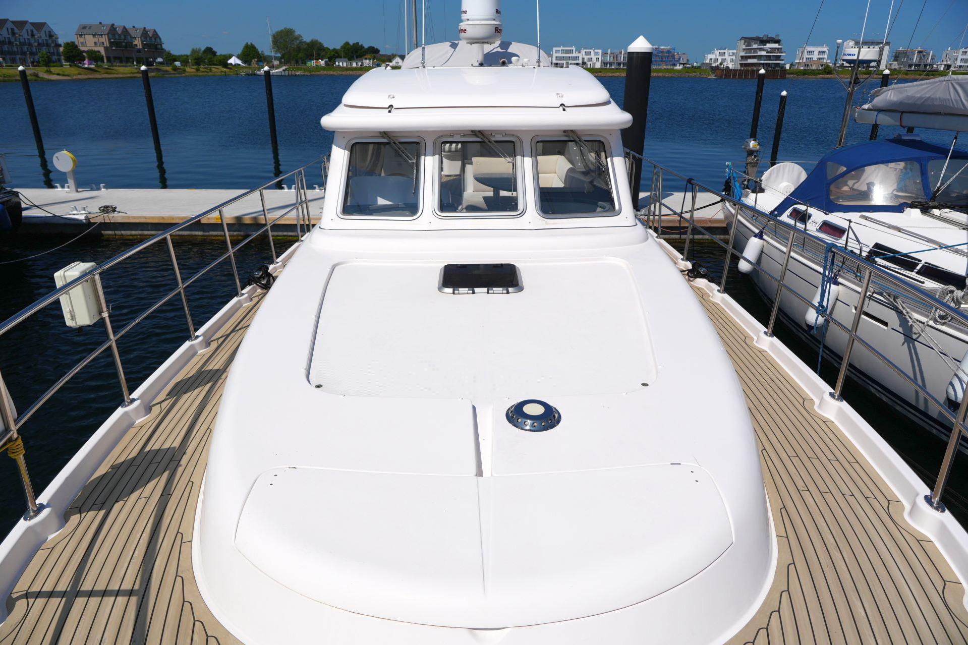2016 Elling E3 Ultimate yacht docked at marina, showcasing sleek design and spacious deck.