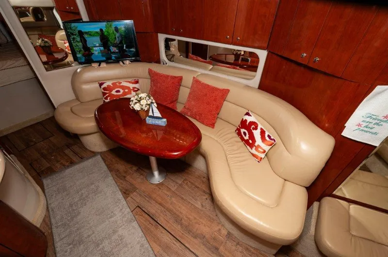 Had 2 Have It Yacht Photos Pics Luxurious 2003 Sea Ray 380 Sundancer interior with plush seating and elegant wooden table.