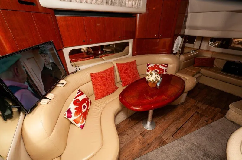 Had 2 Have It Yacht Photos Pics Luxurious 2003 Sea Ray 380 Sundancer interior with plush seating, wooden table, and vibrant cushions.