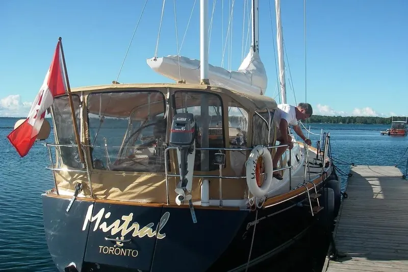 Mistral X Yacht Photos Pics Sailboat Tartan 4300, 2009 model, docked with Canadian flag, named "Mistral."