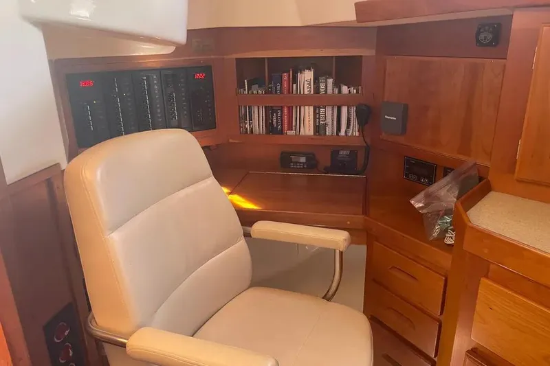 Mistral X Yacht Photos Pics Luxurious Tartan 4300 yacht interior with leather chair and wooden cabinetry, 2009 model.